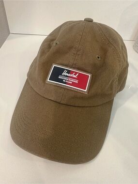 Herschel Supply Company Olive Brown Twill Cap with Red & Navy Tag. 100% cotton.